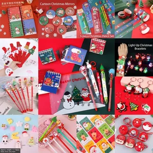 Variety of Christmas stationery gift sets including notebooks pens and festive keychains