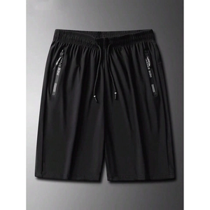 Detail of men's black quick-dry shorts with elastic drawstring waist and zipper pocket