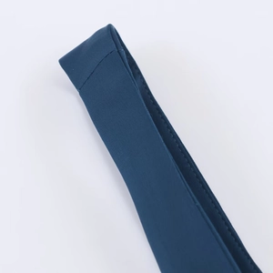 Detailed close-up of the high-density dark blue fabric straps and stitching on the dress