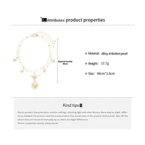 Close-up of gold layered necklace set with starburst pendants and imitation pearls