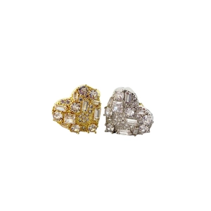 Chic gold and silver heart earrings with micro-pave crystals on a clean white background