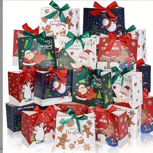 Christmas gift paper bags with cartoon patterns and festive ribbon bows on top