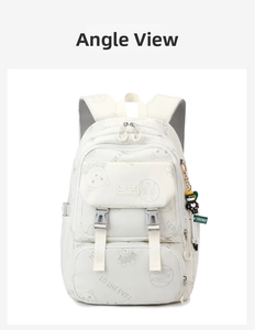 Detail view of large capacity cream school bag with cute bear patterns and side charm