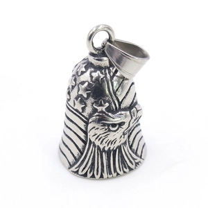 Detailed macro view of vintage eagle and American flag engraving on metal bell pendant