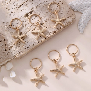 Set of six golden starfish hair rings for girls made of polished metal material