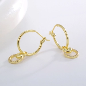 Elegant gold heart hoop earrings with hollow heart pendant and sparkling zircon accents