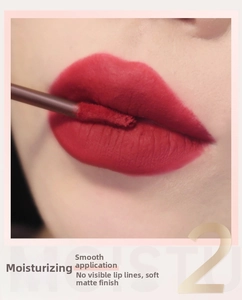Macro shot of matte velvet red liquid lipstick with sponge applicator for smooth finish