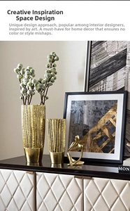 Detail of creative gold resin vases with vertical bark texture and smooth modern finish