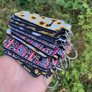 Neoprene lipstick holder keychains in leopard, sunflower and geometric prints