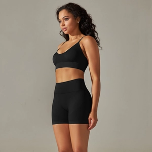 Detail view of black seamless yoga set showing supportive fit and high waist shorts