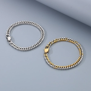 Colliers gourmette bicolores or et argent avec fermoir mousqueton pour un look moderne