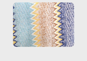 Close-up of ethnic knit shawl featuring zigzag patterns and hollow mesh texture