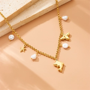 Golden dolphin and starfish necklace with baroque pearls and bee charm on stone base