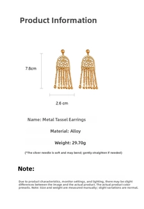 Detail view of vintage gold tassel earrings with measurements and leaf pattern design