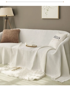 Close-up of white waffle texture cotton sofa cover showing fabric detail and soft weave