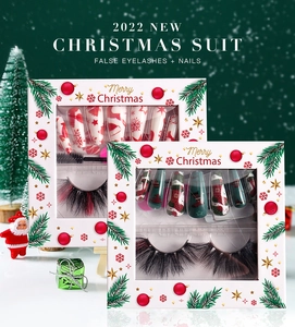Festive Christmas set featuring red and green false eyelashes with snowflake themed press-on nails
