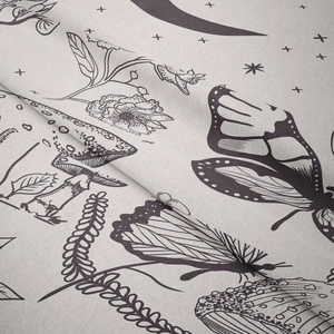 Close-up of bohemian tapestry fabric with butterfly and mushroom prints