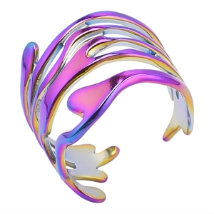 Close-up of adjustable stainless steel bangle with iridescent wavy cutout design