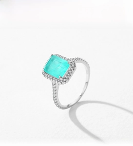 Macro detail of S925 silver ring featuring a square Paraiba gemstone with pavé setting