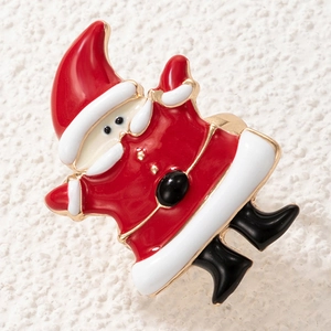 Detailed close-up of a Santa Claus enamel ring with a gold alloy finish for Christmas