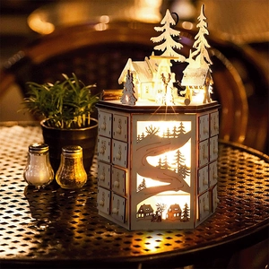 Close-up of laser-cut wooden advent calendar with LED lights and 24 storage drawers