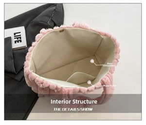 Detail view of pink plush tote bag interior with main pocket, phone slot and magnetic buckle
