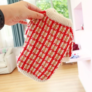 Detail of red and white argyle knit pet sweater with ribbed collar for dogs and cats