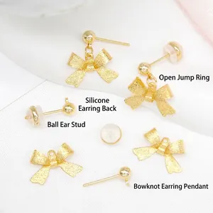 Gold plated brass matte bow earring set with stud components and silicone backings