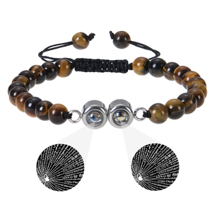 Tiger eye beaded bracelet showing 100 languages I love you projection detail
