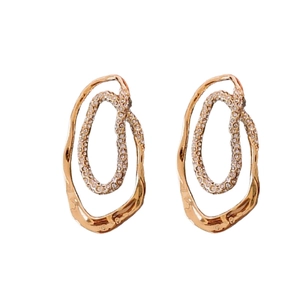 Gold plated irregular double hoop earrings with sparkling rhinestones on white background