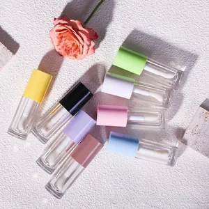 Macro view of 8 colorful 6ml lip gloss empty tubes with large applicator brushes