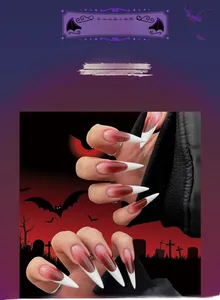 Detail of red and white gradient stiletto press-on nails with Halloween blood effect