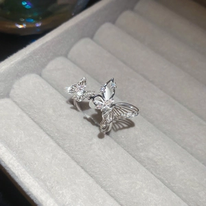 Close-up of zircon butterfly open ring with silver finish and pavé stone detailing