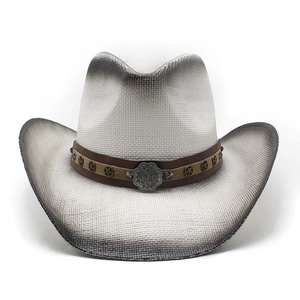 Close-up of vintage straw cowboy hat with leather band and metal star rivets