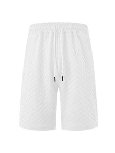 Detail of white men's shorts with herringbone texture, elastic waistband, and black drawstrings
