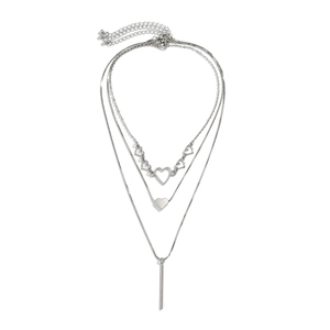 Three-layer silver necklace with heart charms and vertical bar pendant on white background