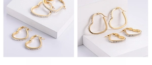 Close-up of heart-shaped gold hoop earrings featuring meticulous pavé-set crystals