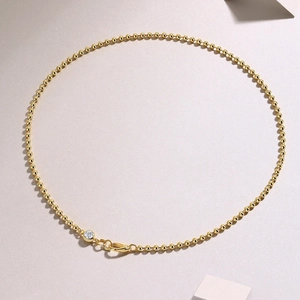 Gold plated 925 sterling silver beaded chain necklace with a round moissanite pendant