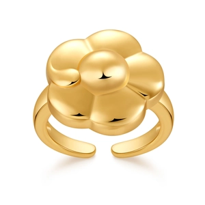 Detailed close-up of 18K gold plated flower ring with polished petals and open band