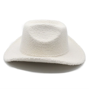 Detailed texture of white plush faux lamb wool fabric on a vintage Western cowboy hat