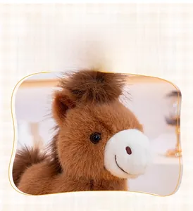 Close-up of cute plush horse head with fluffy brown mane and soft white muzzle details