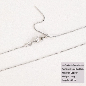 Macro shot of silver 45cm copper box chain with lobster clasp and adjustable bead