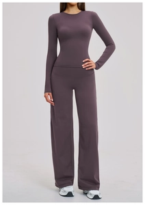 Detail view of deep purple brushed yoga set featuring wide-leg pants and long-sleeve top
