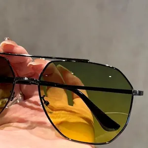 Classic double-bridge aviator sunglasses with black metal frame and night vision lenses