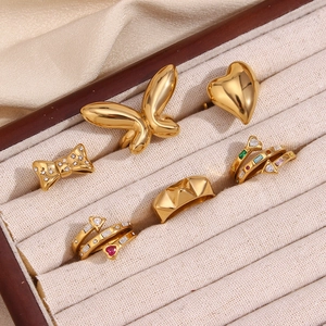 Detailed set of six 18K gold plated stainless steel rings displayed in a velvet box