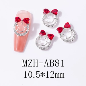 Macro view of nail charms with smiley face and red heart bow, size 10.5x12mm on nail