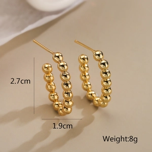 Detailed view of gold beaded C-hoop earrings with 2.7cm height and 1.9cm width dimensions