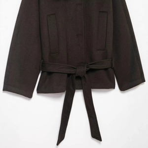 Women's dark brown faux fur jacket with waist tie design and side pockets on white background