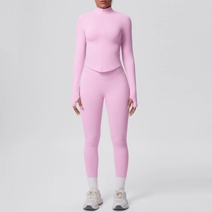 Set yoga rosa senza cuciture con top a maniche lunghe con foro per pollice e leggings