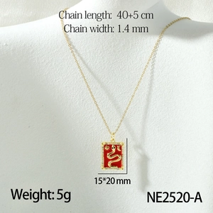 Detail shot of tarot snake pendant necklace in 18k gold plating on a white mannequin